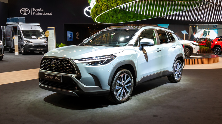 A new Toyota Corolla Cross on display at an auto show.