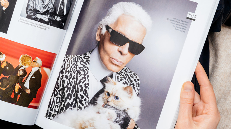 Magazine page with Karl Lagerfeld holding his cat Choupette