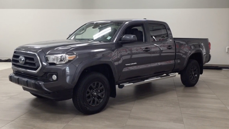A dark gray 2020 Toyota Tacoma SR5 on display in a garage