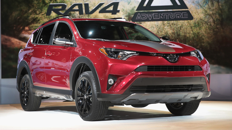A red 2018 Toyota RAV4 Adventure on display at the Chicago Auto Show