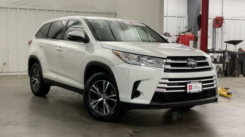 A white 2019 Toyota Highlander parked in a garage