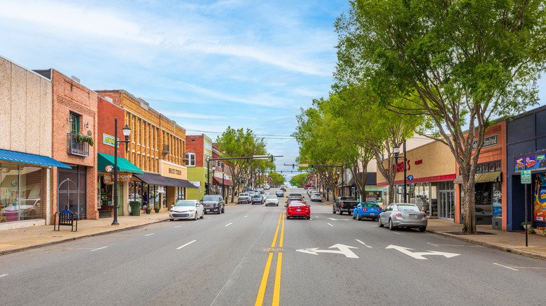 A string of cars driving up and down Main Street in Lexington, North Carolina