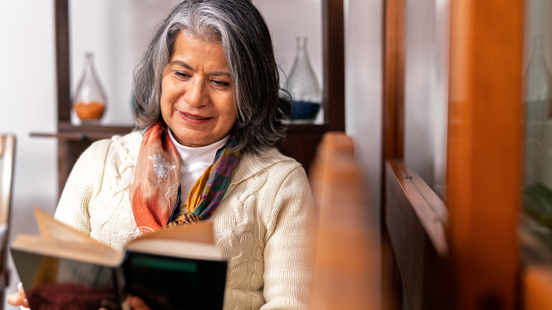 a senior reading a book