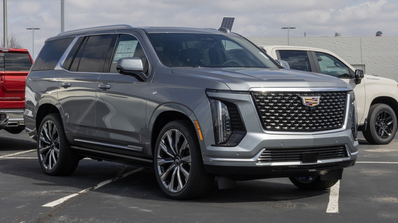 Cadillac Escalade Luxury 4WD Full Size SUV display at a dealership.