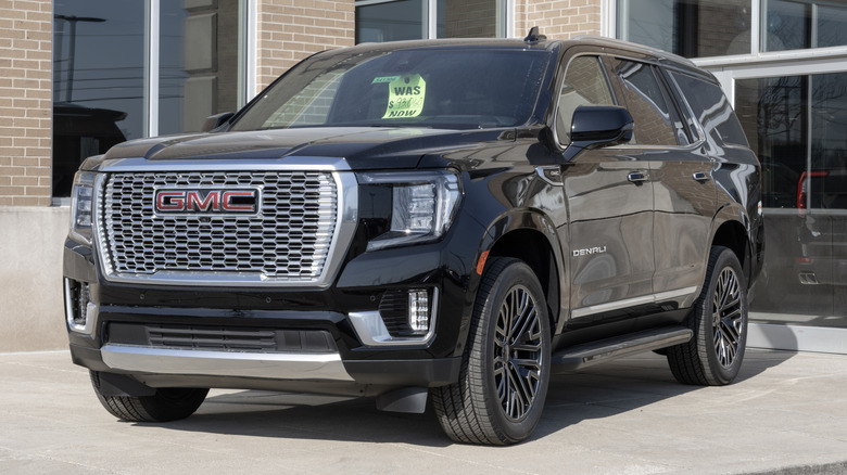 GMC Yukon 4WD Denali SUV display at a dealership.