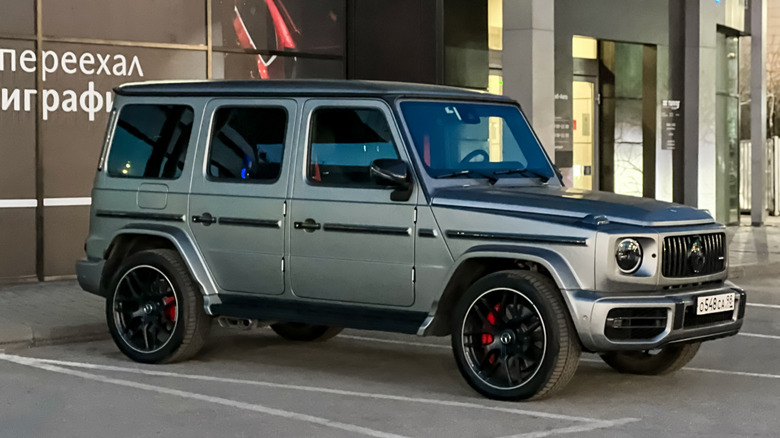 Gray Mercedes Benz G63 AMG parked in a city street.