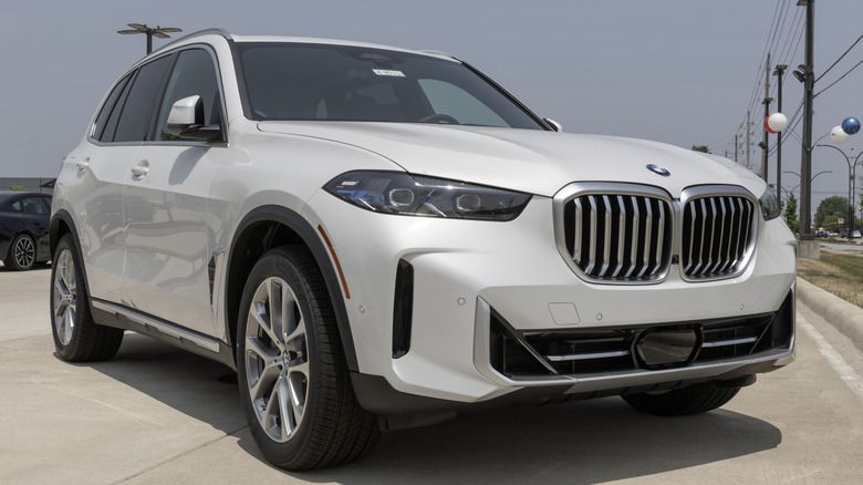 Sportive crossover car BMW X5M at dealership