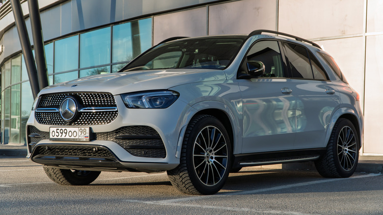 White Mercedes-Benz GLS 63 AMG V8 Biturbo parked on street.
