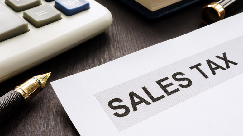 Paper on office table that says sales tax.