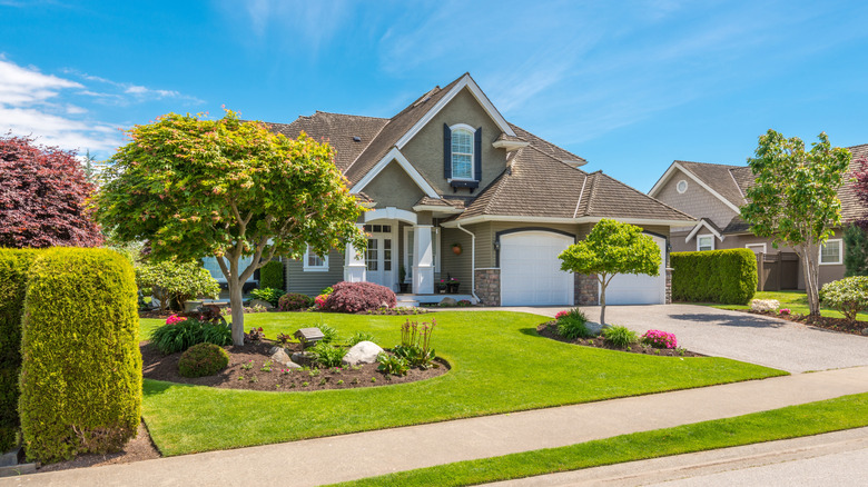 Fragment of luxury house with nice summer landscape.