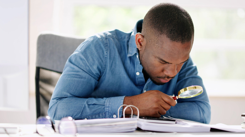 man examining financial documents