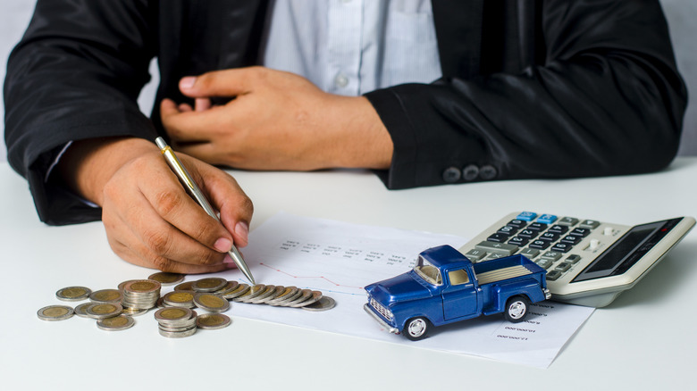 car, money, person calculating