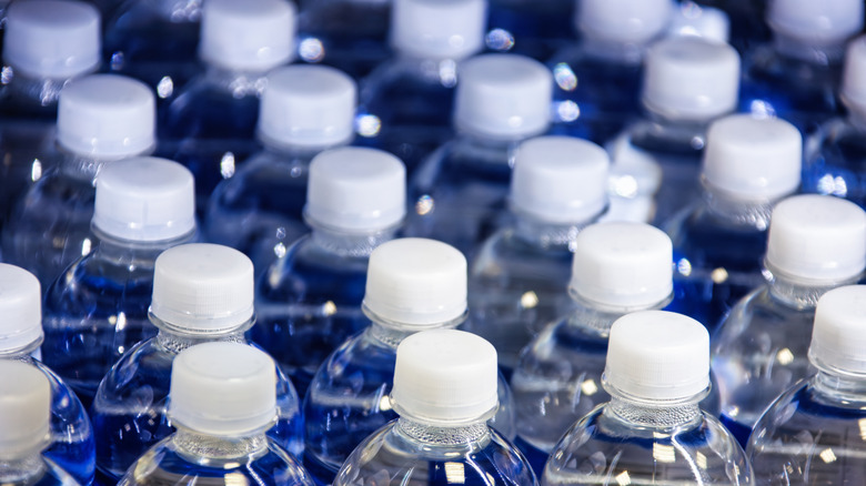 View of the tops of water bottles, arranged in rows
