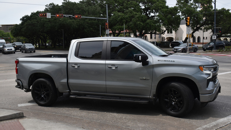 A grey and black Chevy Silverado 1500 pick-up truck cruising near Herman Park in Houston.