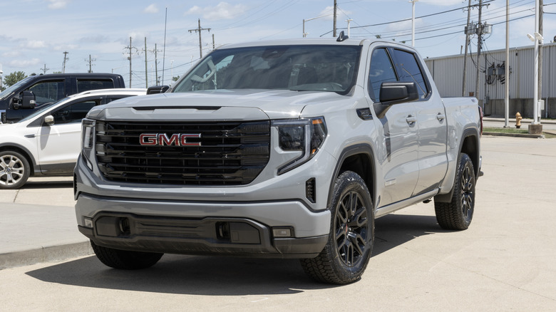 A light grey GMC Sierra 1500 X31 display at a dealership.