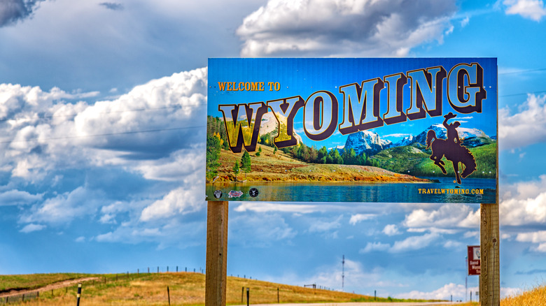 Welcome to Wyoming road sign against blue sky