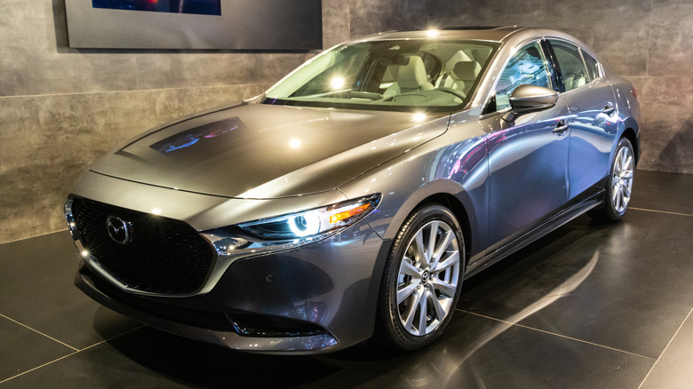 A gray 2019 Mazda 3 Sedan at the 97th Brussels Motor Show 2019 Autosalon.