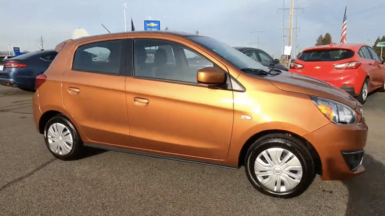 An orange 2019 Mitsubishi Mirage ES CVT in a dealership aprking lot