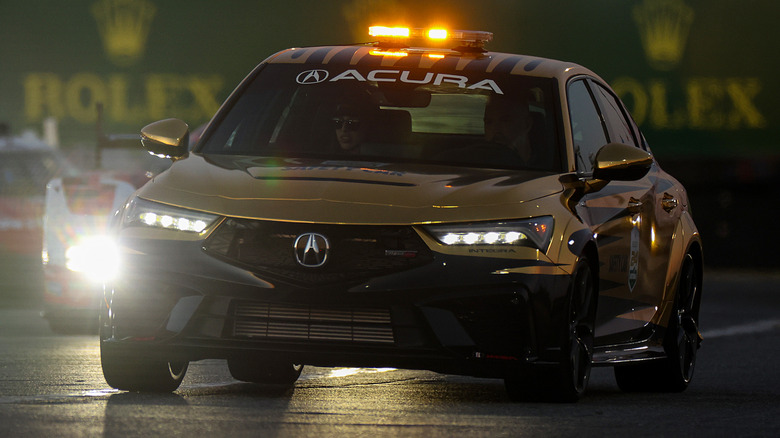Black Acura Integra driving on the highway