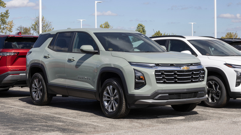 A matte grey Chevrolet Equinox at a dealership.
