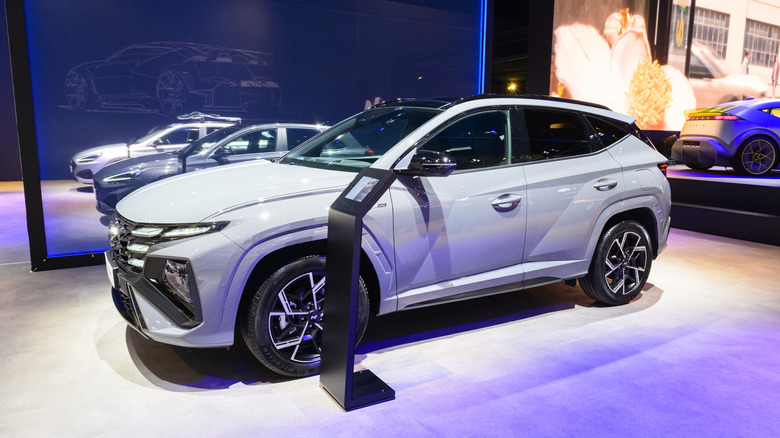 A white Hyundai Tucson compact crossover SUV on display at the AutoSalon.