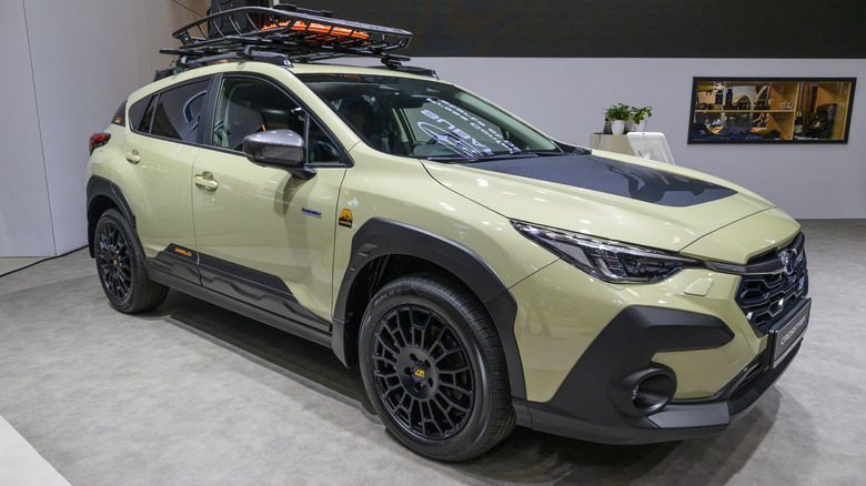 A light green Subaru Crosstrek crossover SUV on display at the AutoSalon.