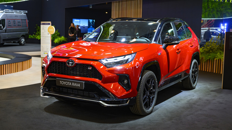 A red Toyota RAV4 on display.
