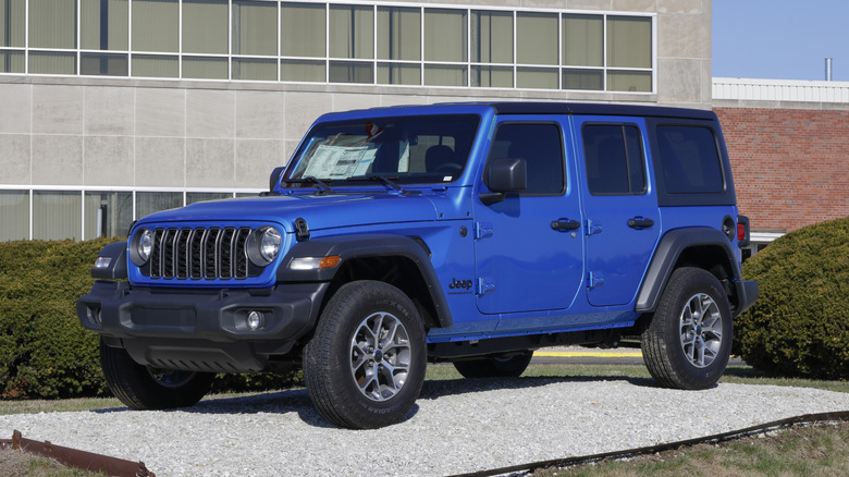 A blue Jeep Wrangler on display.