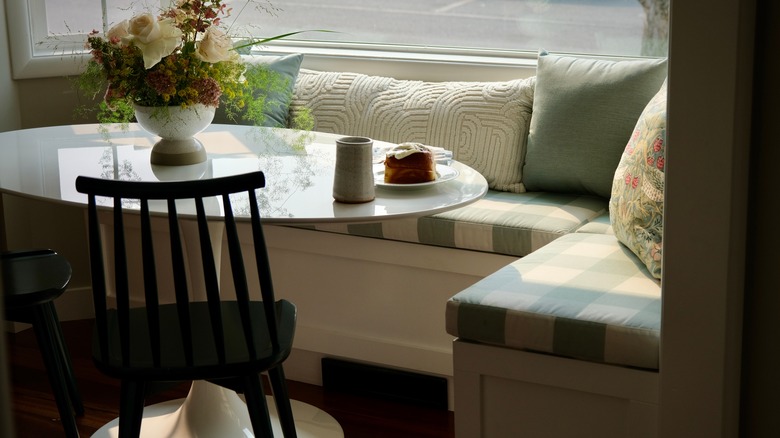 kitchen cushioned banquette with throw pillows