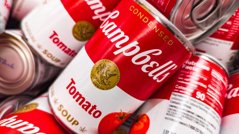 Close up of a pile of Campbell's tomoato soup cans
