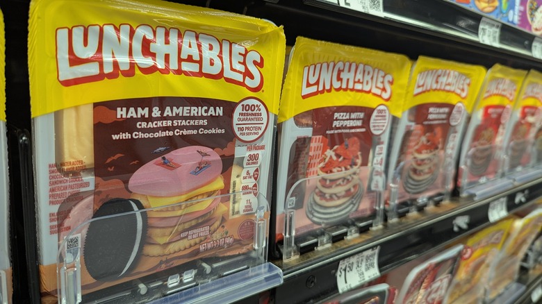 Lunchables ham and American crackers and pizza in store aisle