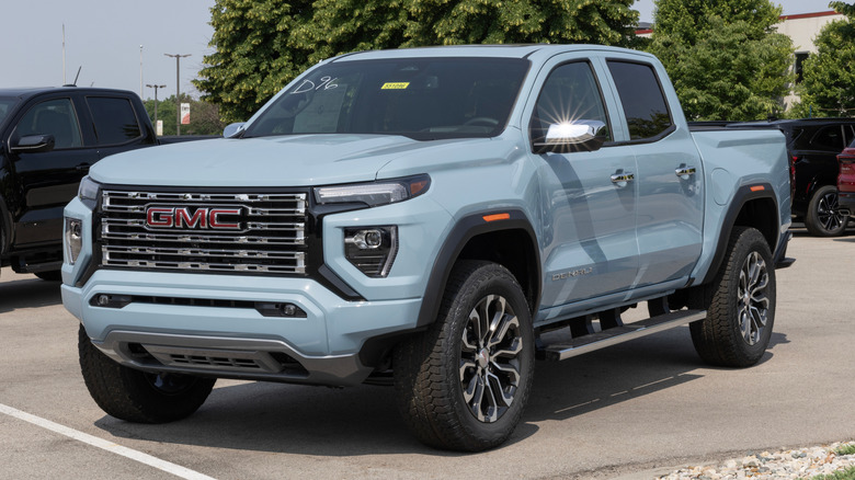 GMC Canyon 4WD Denali pickup display at a dealership.