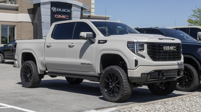 GMC Sierra 1500 Denali 4WD truck at a dealership.