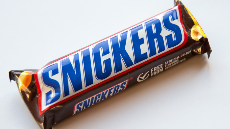 Close up of Snickers bar against white background