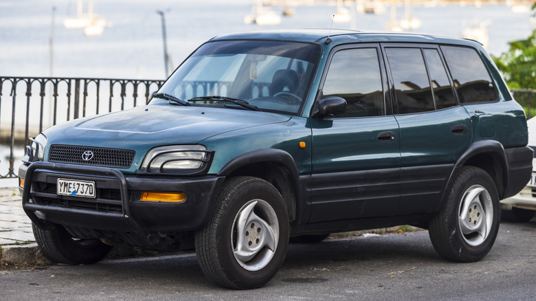 A first-generation RAV4 parked on the road.