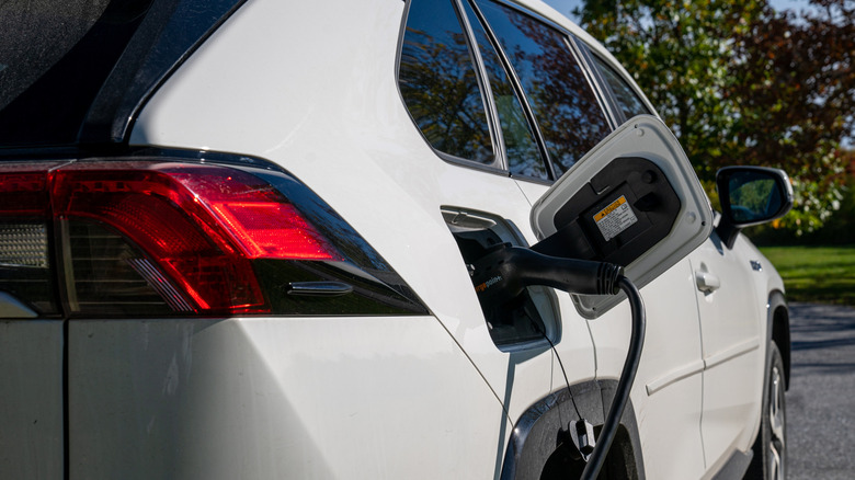 A 2021 Toyota RAV4 Prime electric car is recharged at a charging station at the town hall in Charlotte, Vermont
