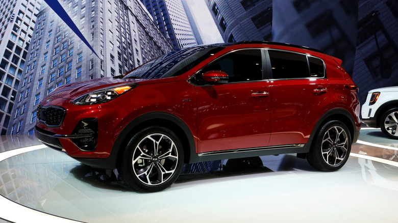 A red 2020 Kia Sportage on display at a car show