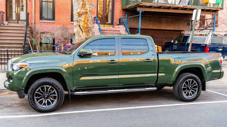 A green 2021 Toyota Tacoma TRD Sport V6 parked outdoor.