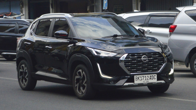 A black 2022 Nissan Kicks on the street