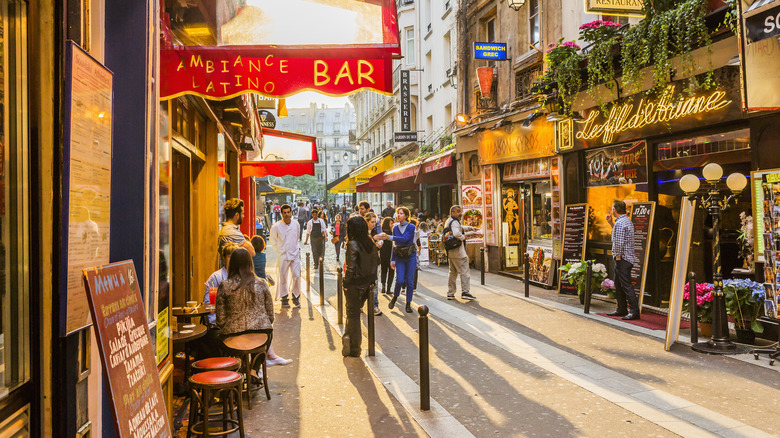 a street with lots of restaurants along its length