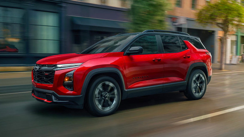red Chevrolet Equinox with black trim on city street