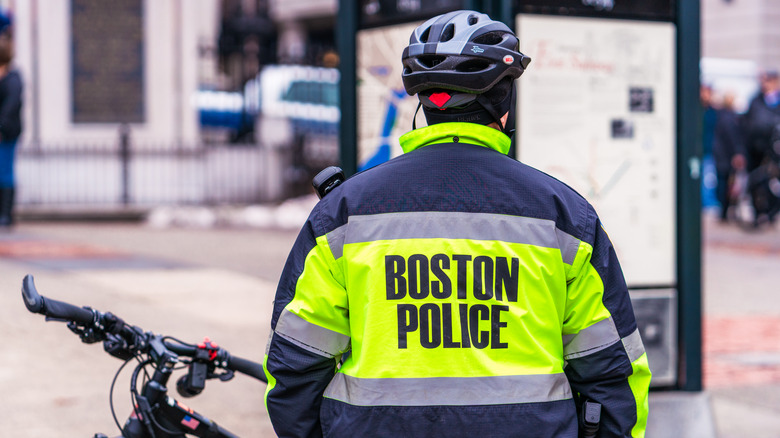 A bike cop with their back to the camera in Boston, MA.