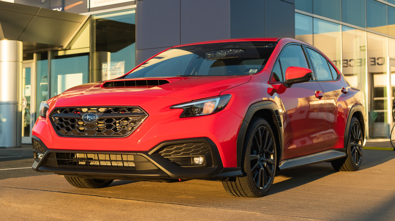 A 2022 Subaru Impreza WRX sedan at a Subaru dealership.