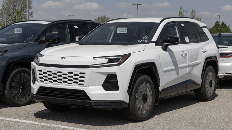 Toyota RAV4 SE Plug-In Hybrid AWD SUV at a dealership.