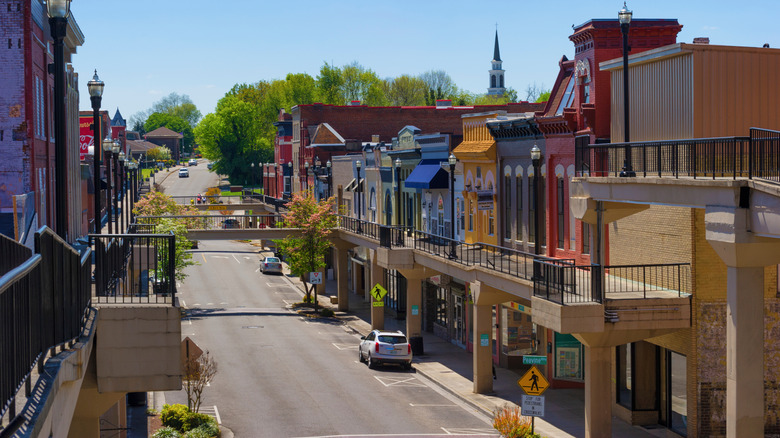 Shops and apartments line either side of a street in Morristown, Tennessee