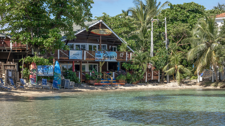 two-story bar named Ginger's at the water's edge
