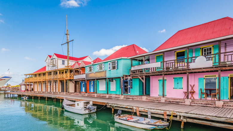 colorful small businesses and homes along a pier in St John's