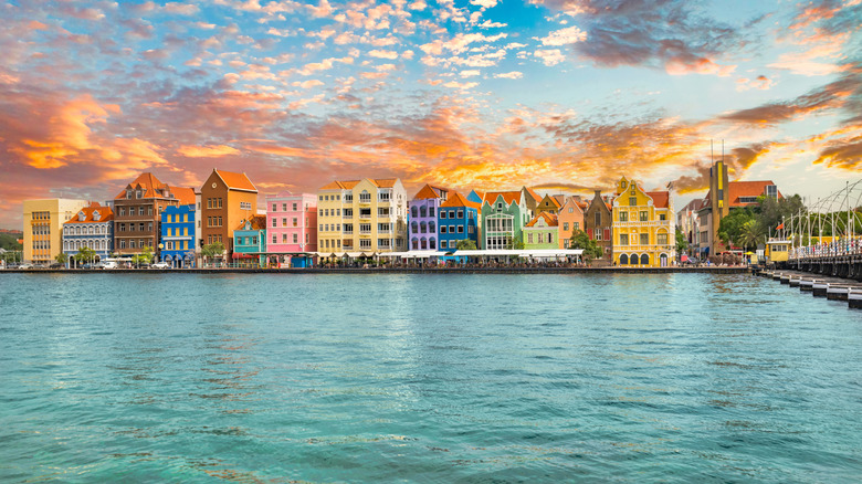 colorful waterfront multi-story buildings in Willemstad at sunset