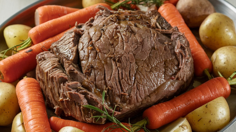 Chuck tender roast cooked mixed in with vegetables.