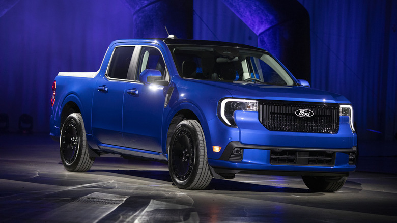 A 2025 Ford Maverick truck is shown at a Ford "Detroit Proud" event.